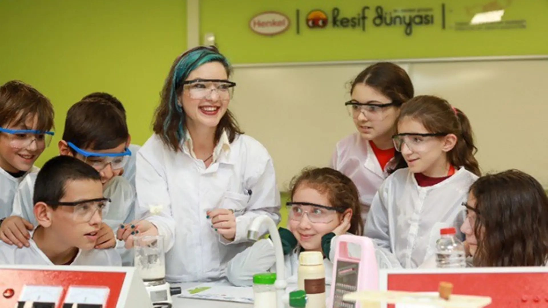 woman with six children in lab coats