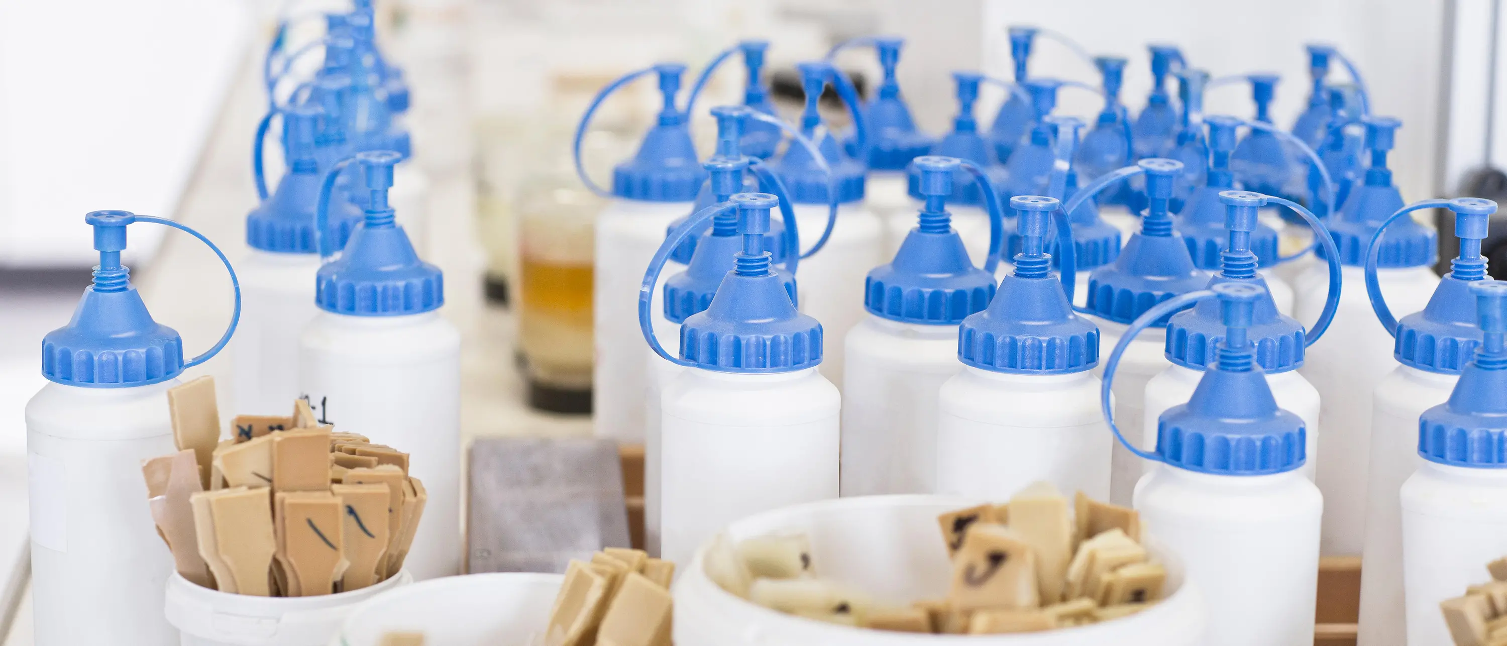 white plastic bottles and wooden spoons