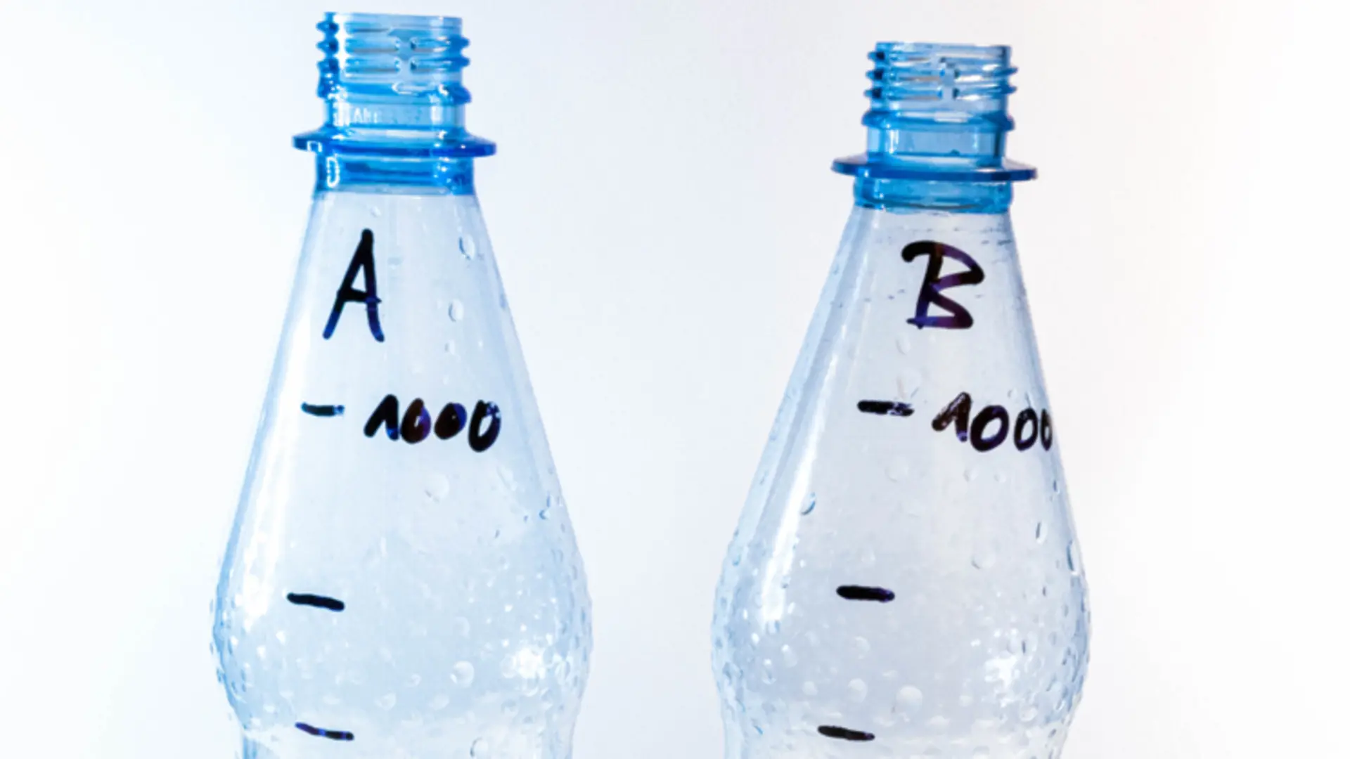 two empty plastik bottles with markers