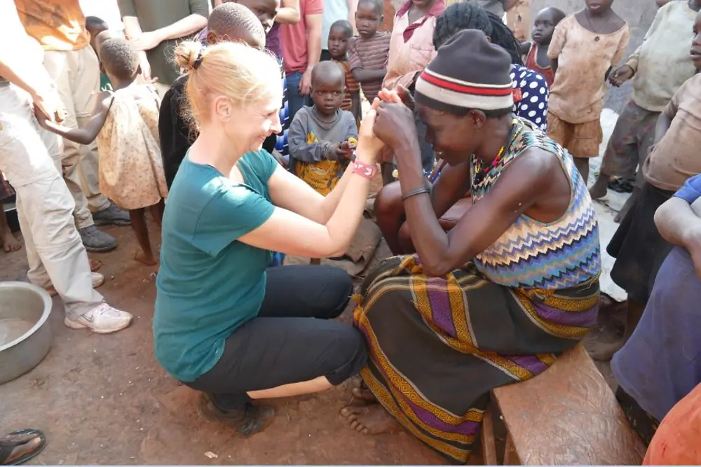 Gabriele Haak from Germany with the mother of one of the girls who lives in the Mirembe Cottage of Street Girls in Jinja, Uganda