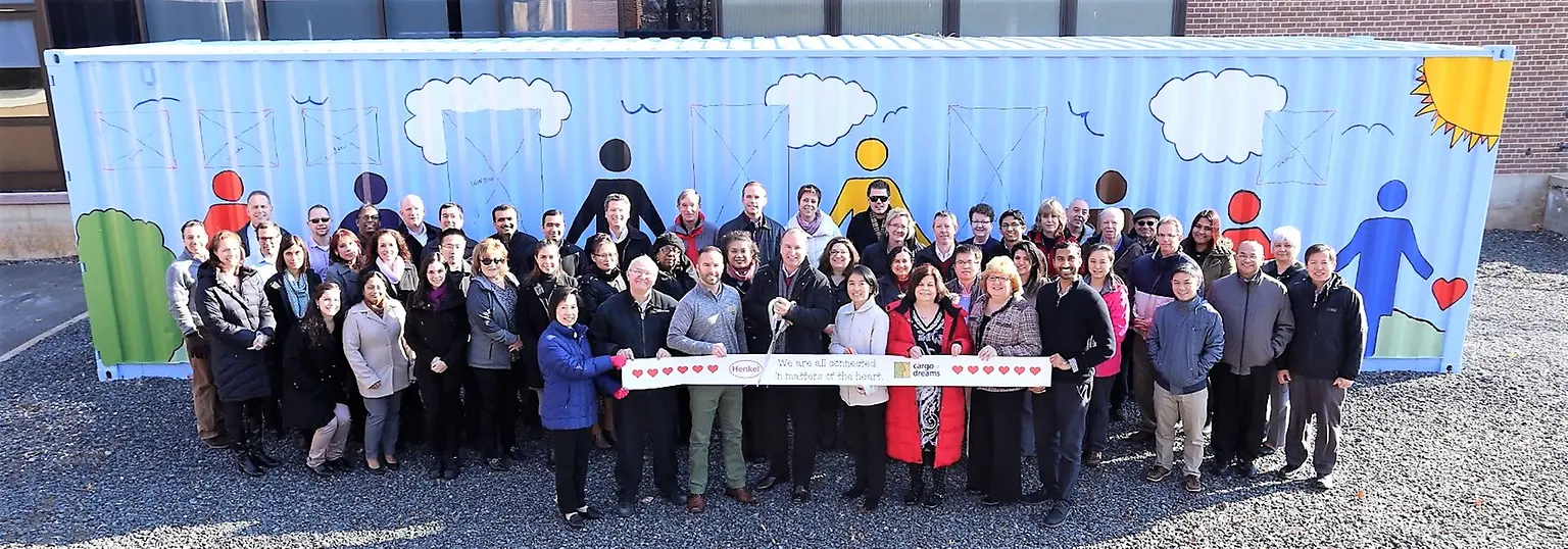 Bridgewater employees celebrate the completion of the Cargo of Dreams construction 